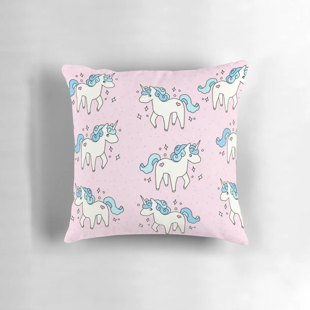 Soft, plush unicorn pattern pillow in pastel colors with a scattered design.
