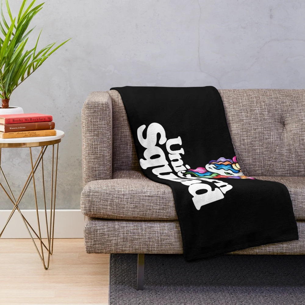 Colorful unicorn plush blanket with rainbow design