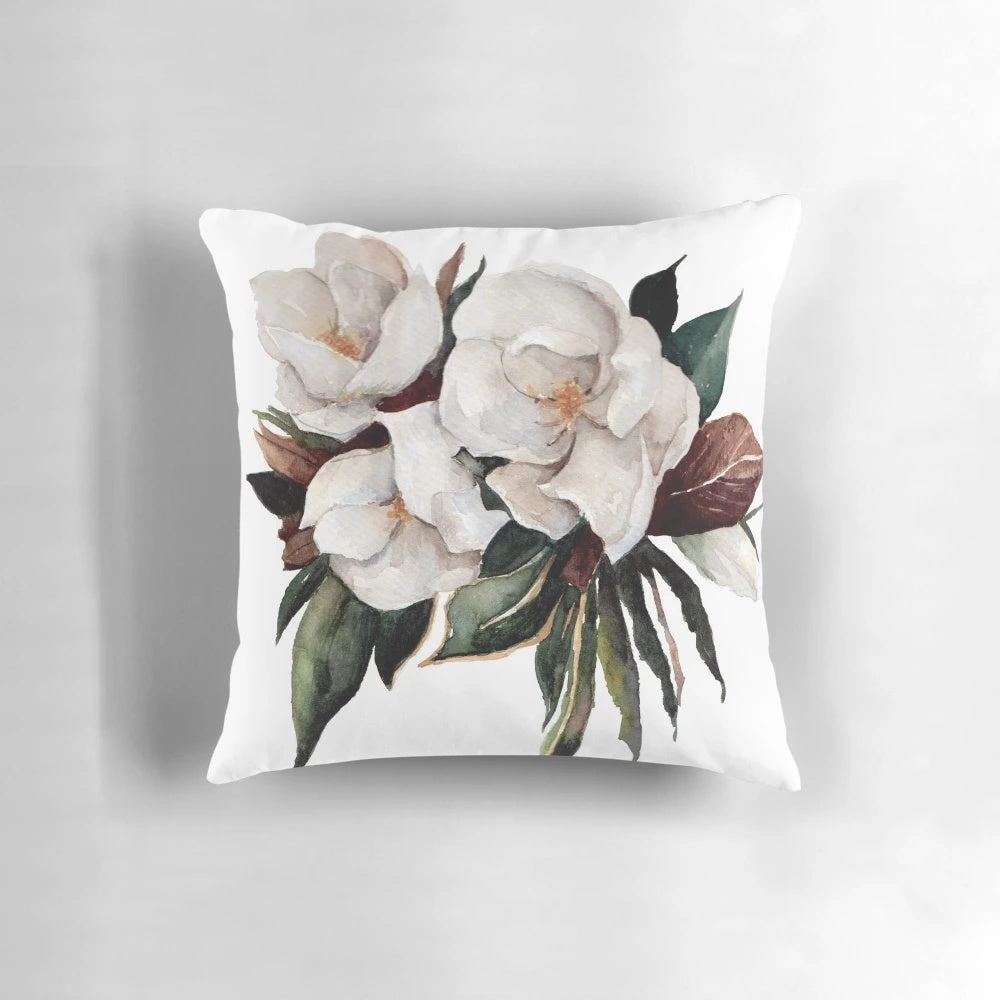 Magnolia floral and botanical watercolor painting on a decorative throw pillow