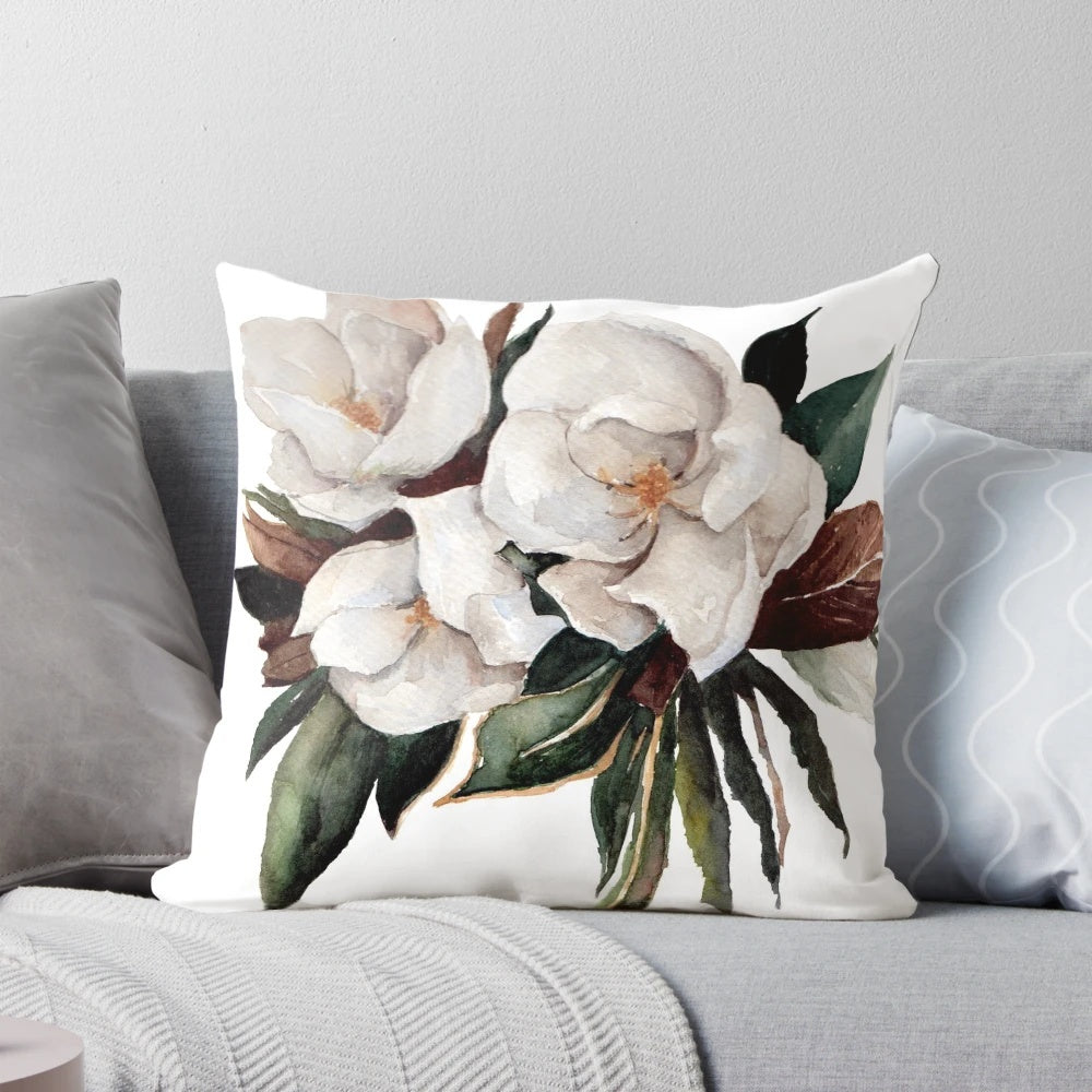 Magnolia floral and botanical watercolor painting on a decorative throw pillow