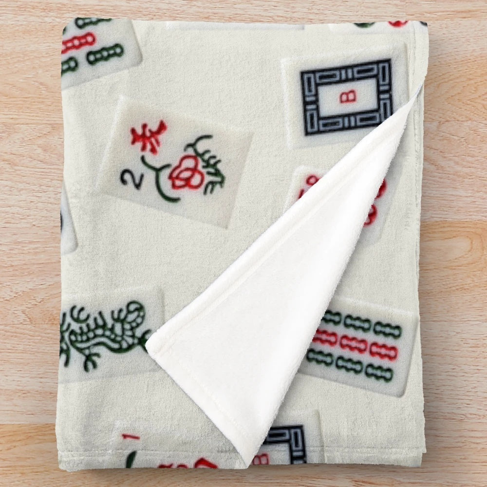 Mahjong-inspired plush blanket featuring mahjong tile patterns and designs