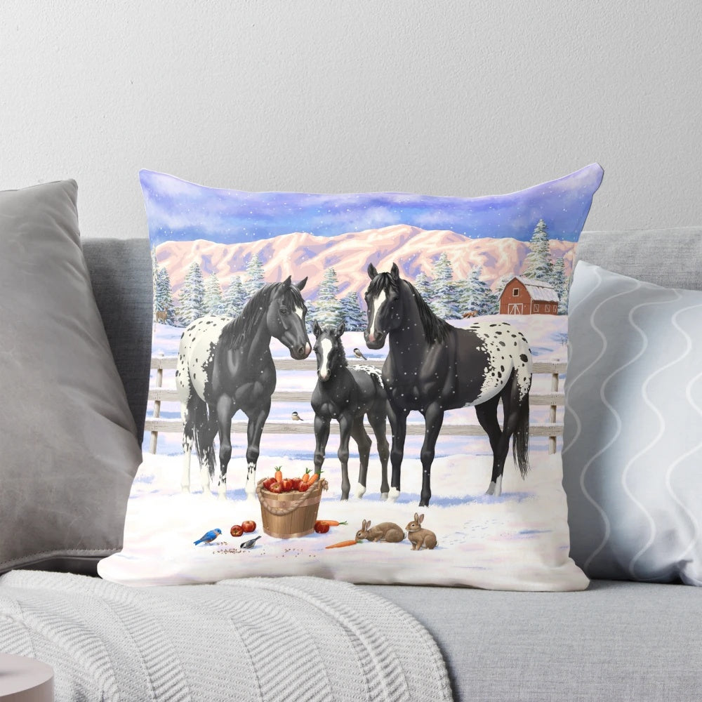 A Pillow featuring a beautiful black Appaloosa horse family in a snowy winter scene.