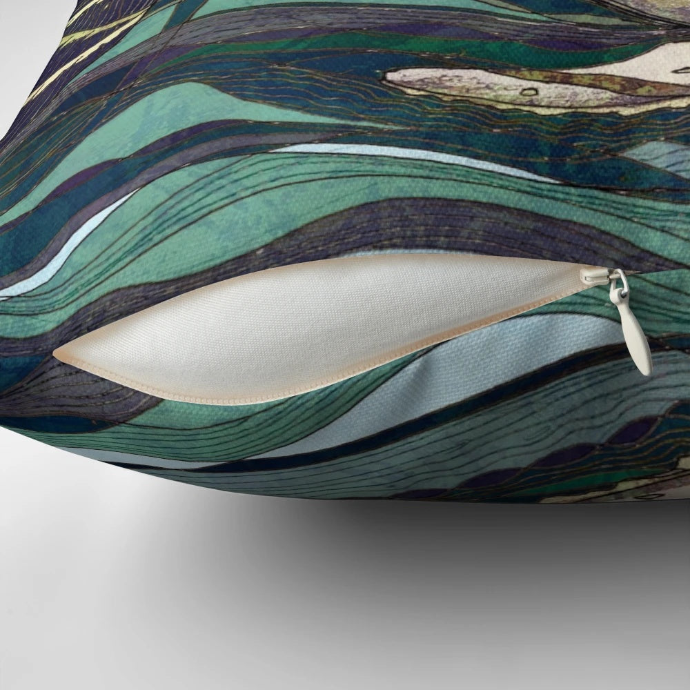 A decorative pillow featuring a whale, the sea, and a sailing ship, with a focus on the "leviathan" keyword.