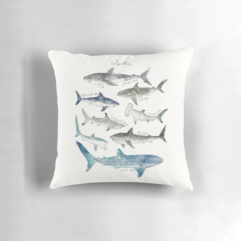 Decorative pillow featuring a stunning landscape illustration of sharks swimming in the ocean.