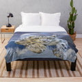 Snow leopard plush blanket with moon and stars design