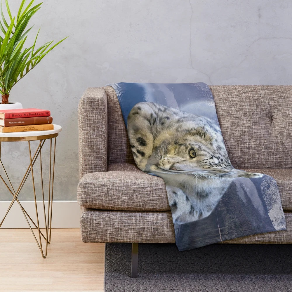 Snow leopard plush blanket with moon and stars design