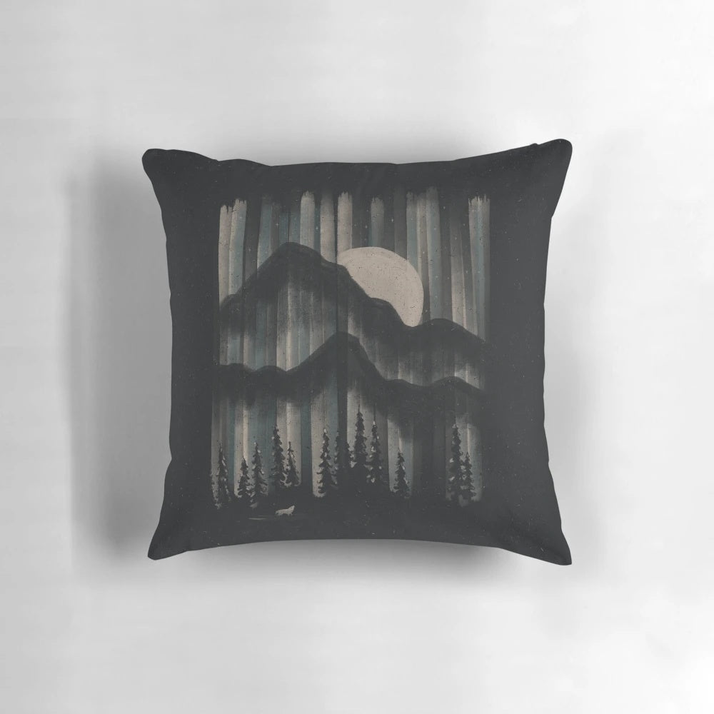 A Pillow featuring a Majestic Wolf Prowling the Moonlit Mountains