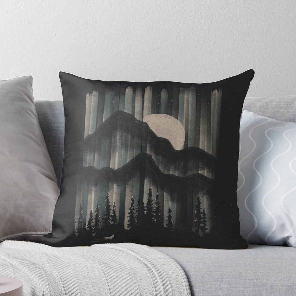A Pillow featuring a Majestic Wolf Prowling the Moonlit Mountains