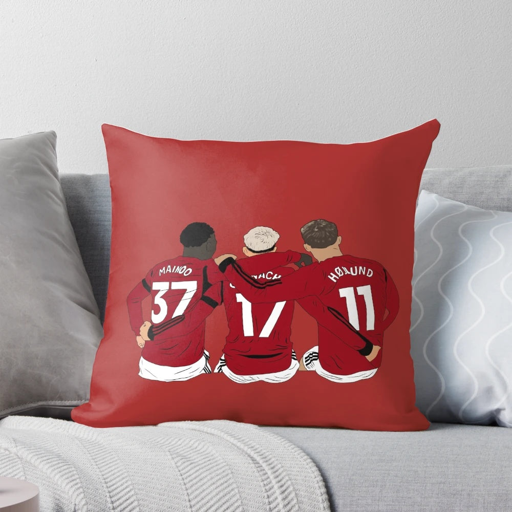 Minimalist pillow featuring Manchester United youth players Kobbie Mainoo, Alejandro Garnacho, and Rasmus Højlund