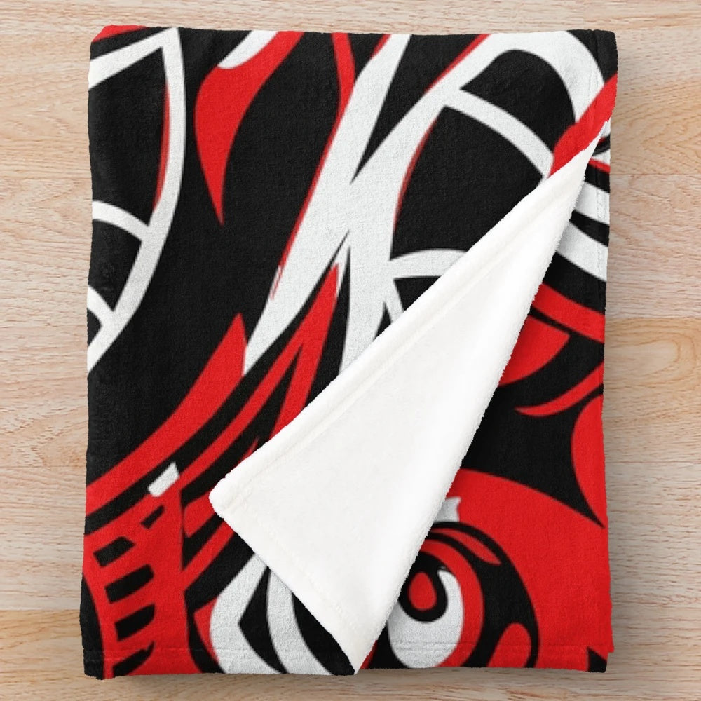 Maori-inspired plush blanket with tribal patterns and ethnic design