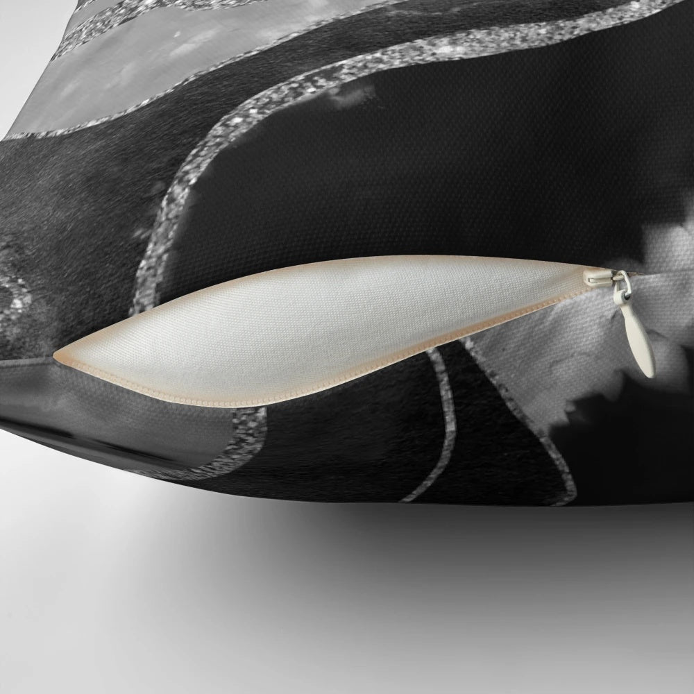 A decorative gray, black, and white marble agate silver glam pillow featuring a non-reflective glitter design.