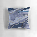 A decorative pillow showcasing a vibrant blue and silver marbled agate design.