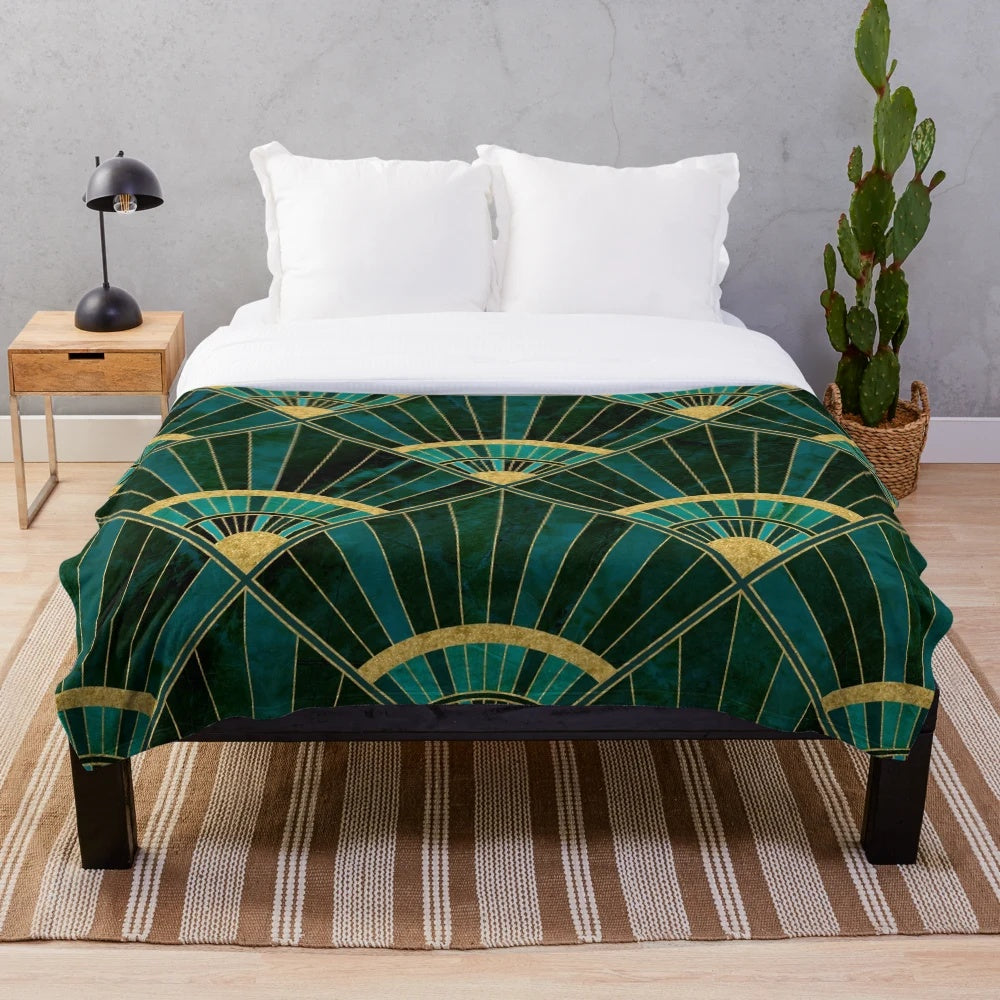 Marbled geometric pattern plush blanket in green, gold, and vintage art deco style