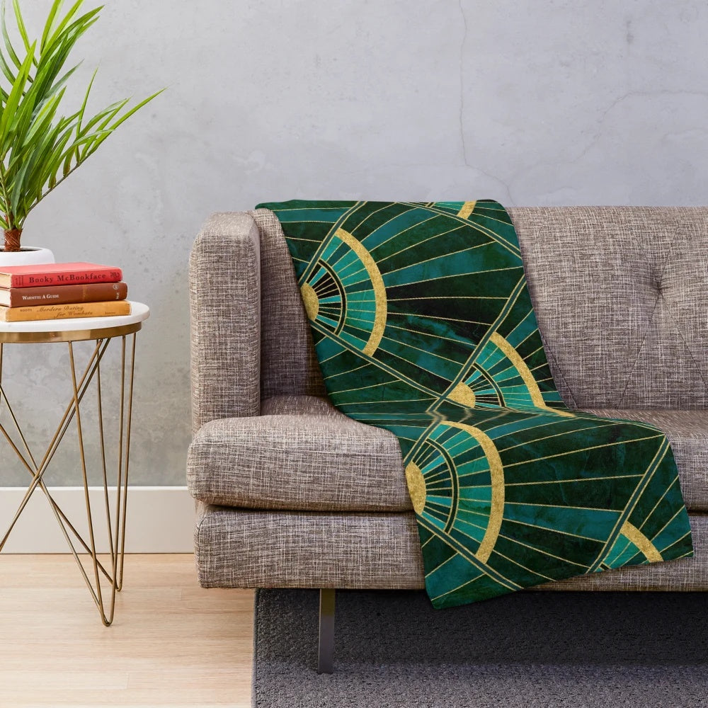 Marbled geometric pattern plush blanket in green, gold, and vintage art deco style