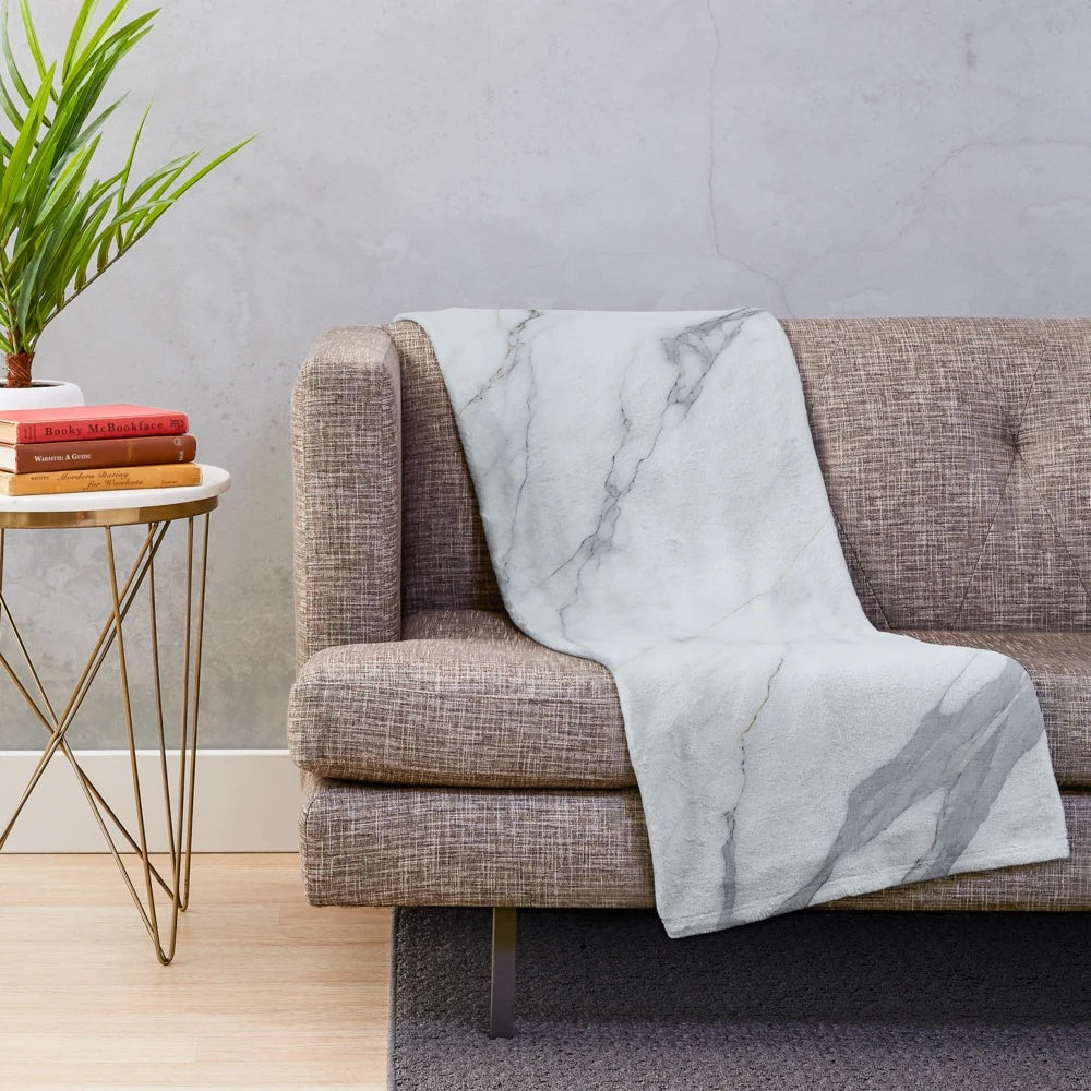 Marbleized plush blanket with abstract, fluid texture and pattern