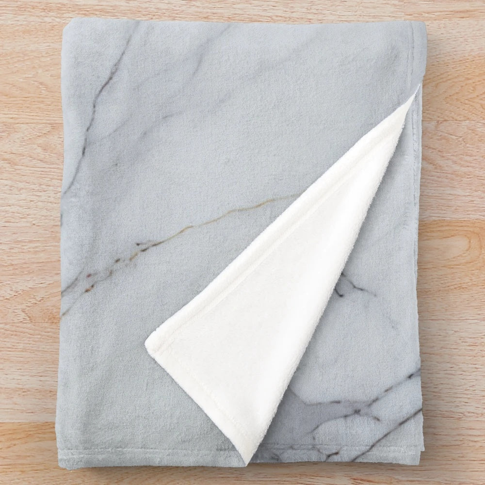 Marbleized plush blanket with abstract, fluid texture and pattern