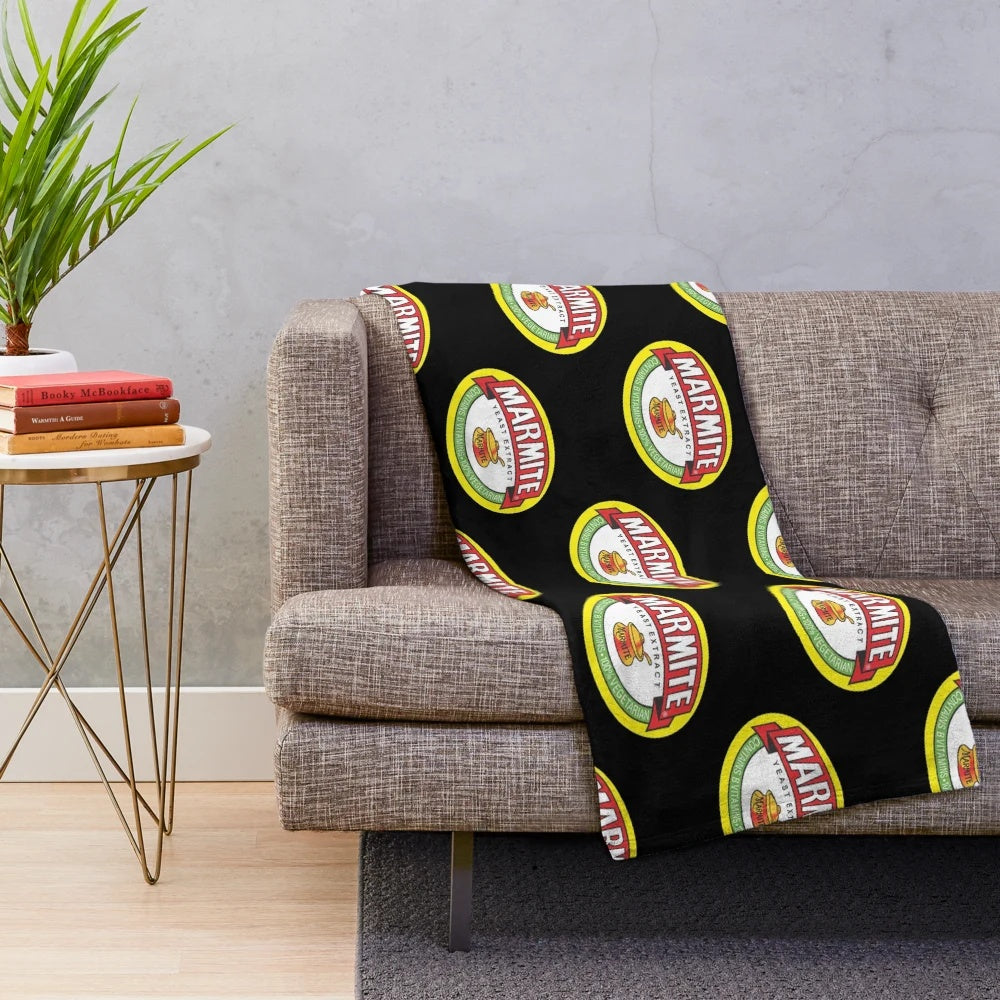 Marmite logos plush blanket, featuring the iconic Marmite logo design
