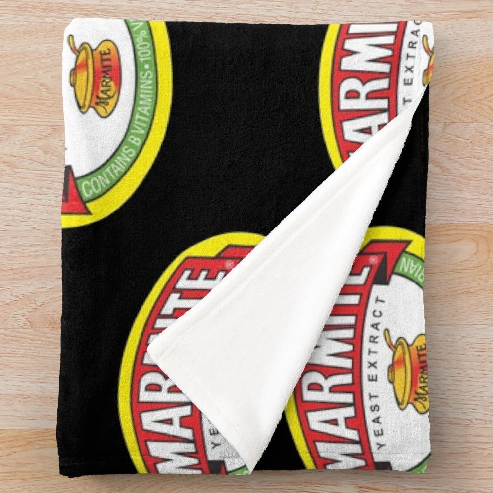 Marmite logos plush blanket, featuring the iconic Marmite logo design