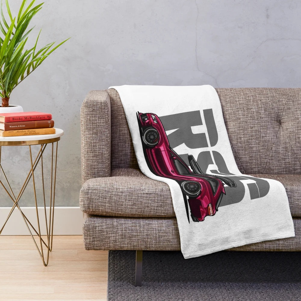 Maroon plush blanket featuring the Audi RS6 Avant sports car