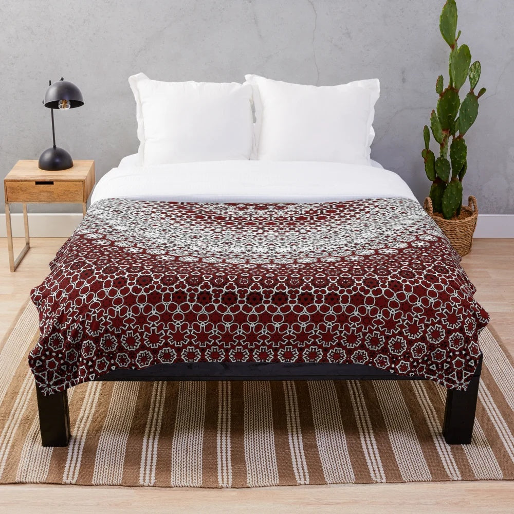 Maroon plush blanket with sindhi ajrak inspired floral pattern