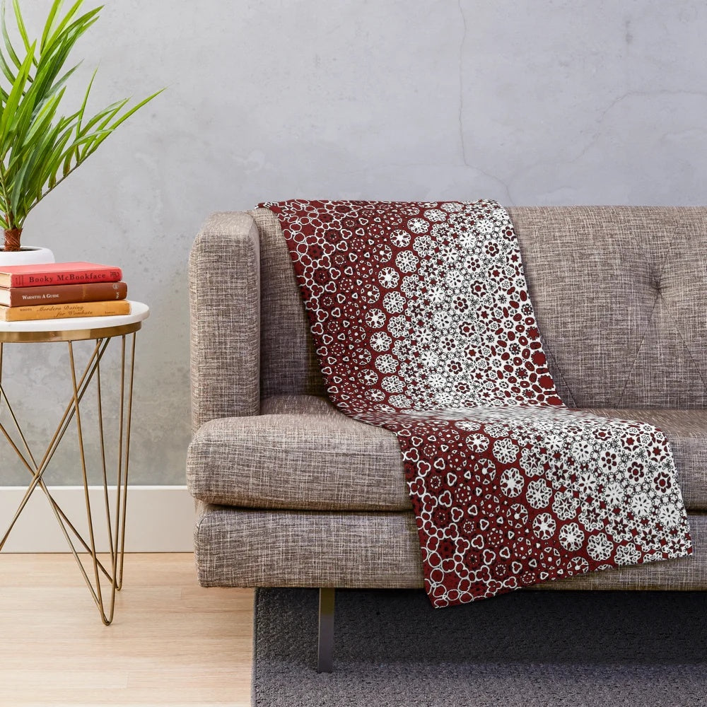 Maroon plush blanket with sindhi ajrak inspired floral pattern
