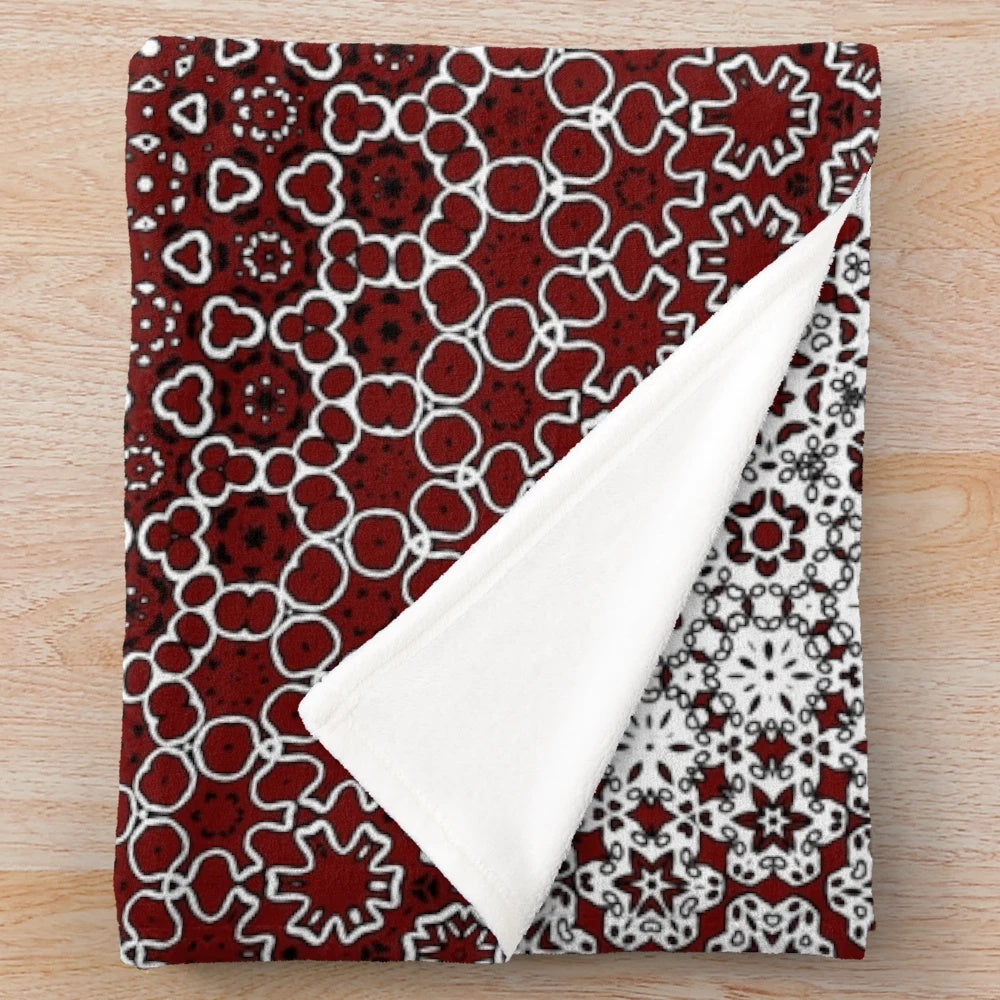 Maroon plush blanket with sindhi ajrak inspired floral pattern