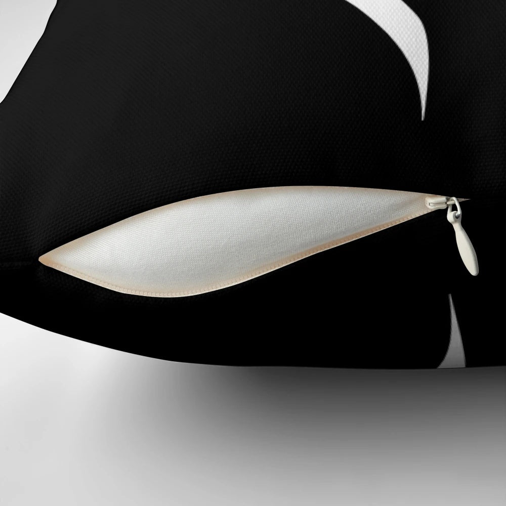 A white pillow with the silhouette of Garrus Vakarian, a popular character from the Mass Effect video game series.