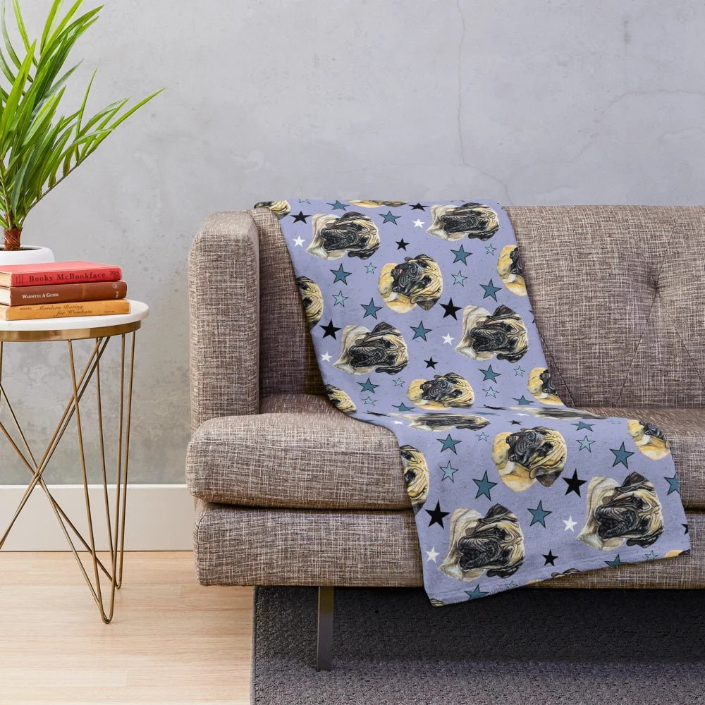 Mastiff dog portrait on a blue plush blanket