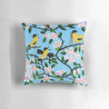 Maud Lewis inspired farmhouse-style pillow featuring a whimsical folk art painting of a cozy cottage, farm animals, and seasonal landscapes.
