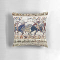 Detailed embroidered pillow depicting the famous Battle of Hastings with Norman knights on horseback.