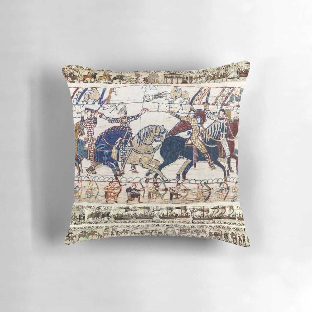 Detailed embroidered pillow depicting the famous Battle of Hastings with Norman knights on horseback.