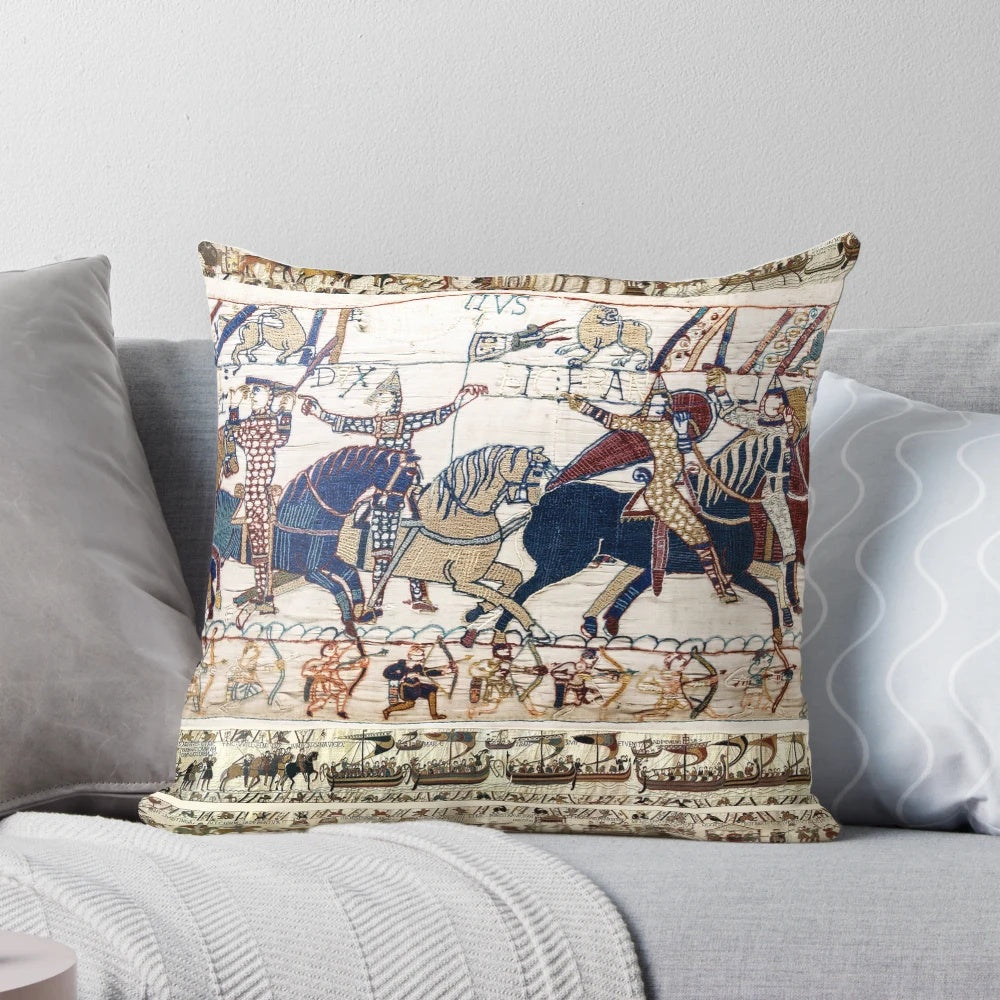 Detailed embroidered pillow depicting the famous Battle of Hastings with Norman knights on horseback.