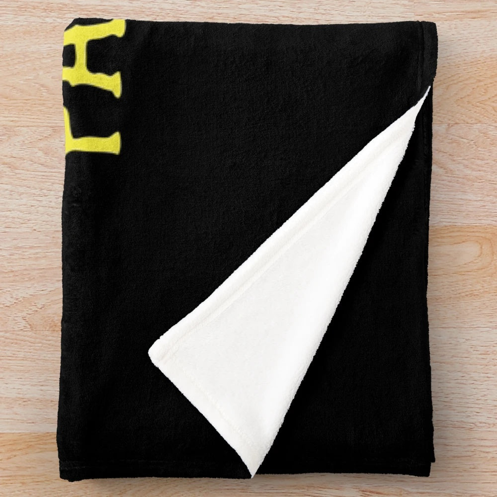 Plush blanket with a Medusa-inspired feminist design, encouraging people to "Petrify the Patriarchy