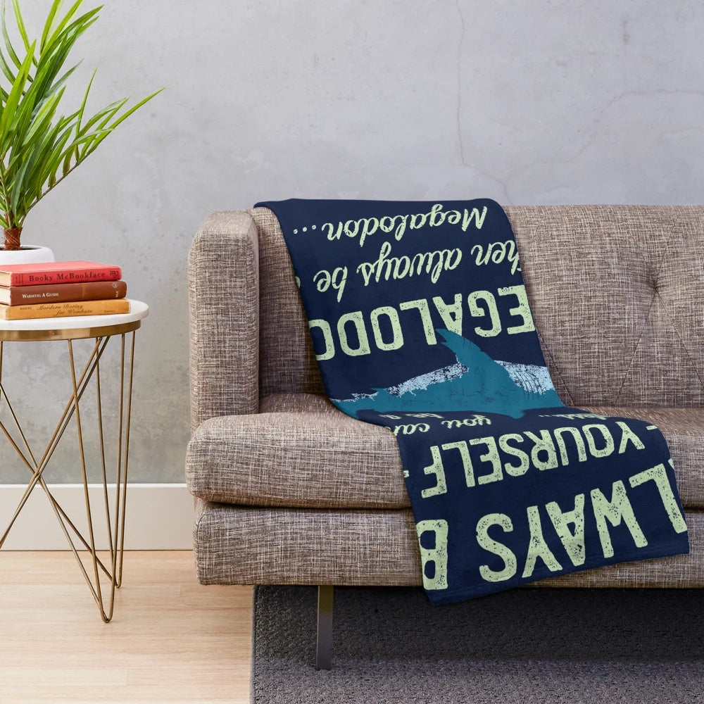 Megalodon themed plush blanket with shark teeth design