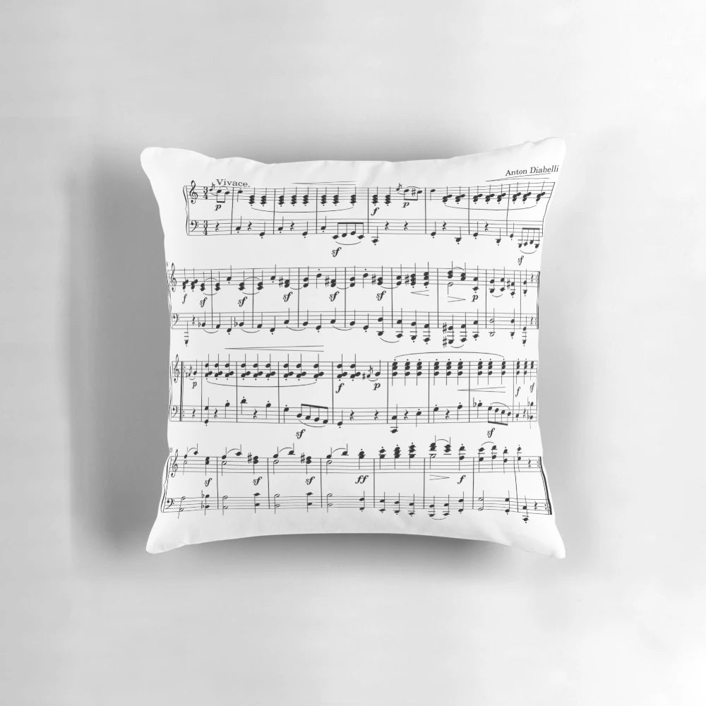 A plush, decorative pillow featuring a vibrant design of musical notes and sheet music, perfect for music enthusiasts.