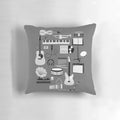 A decorative pillow featuring various musical instruments and music-themed icons.