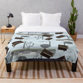 A plush blanket featuring a musical motif of piano keys and treble clef