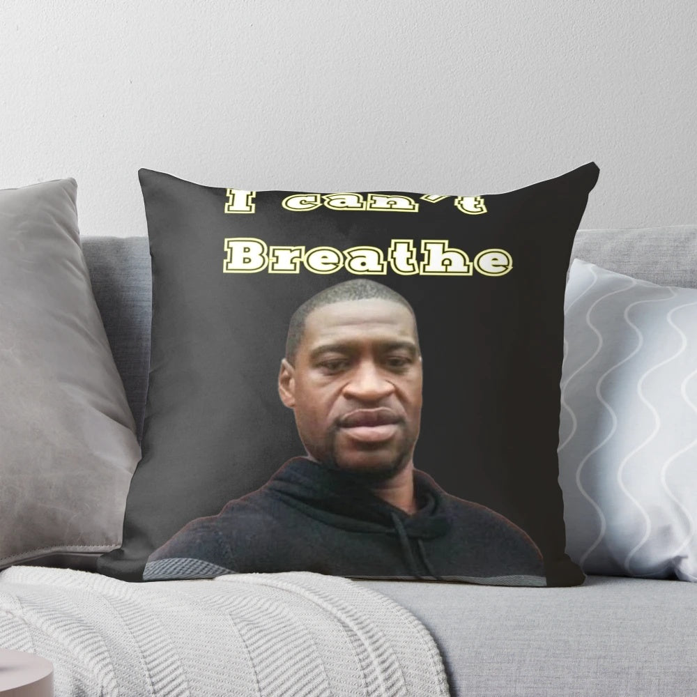 Memorial pillow featuring the words "Breathe" in a yellow color, honoring George Floyd.