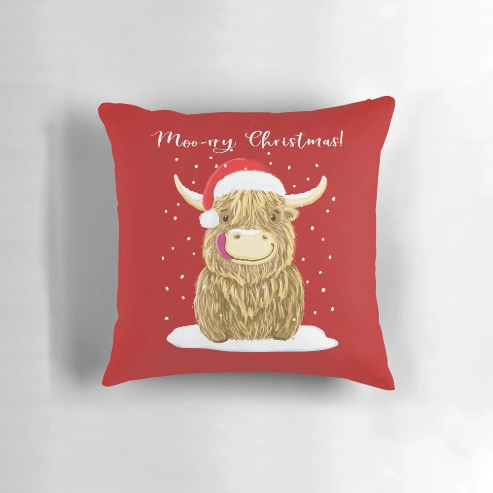 A cozy, festive Scottish Highland Cow pillow wearing a Santa hat and scarf.