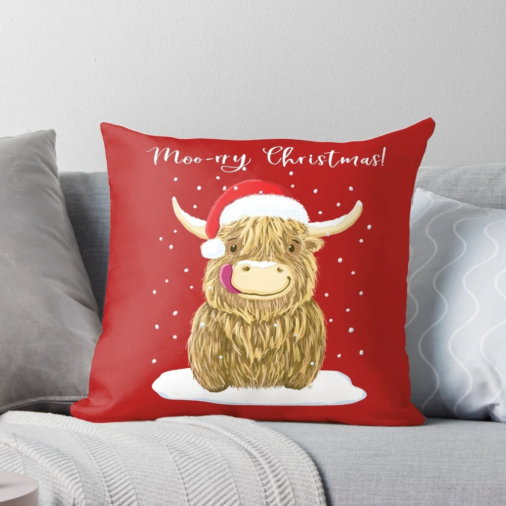 A cozy, festive Scottish Highland Cow pillow wearing a Santa hat and scarf.