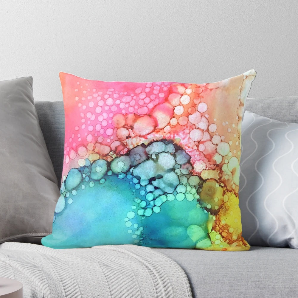 Vibrant and fluid abstract art design featuring colorful bubbles and dynamic movement on a plush pillow