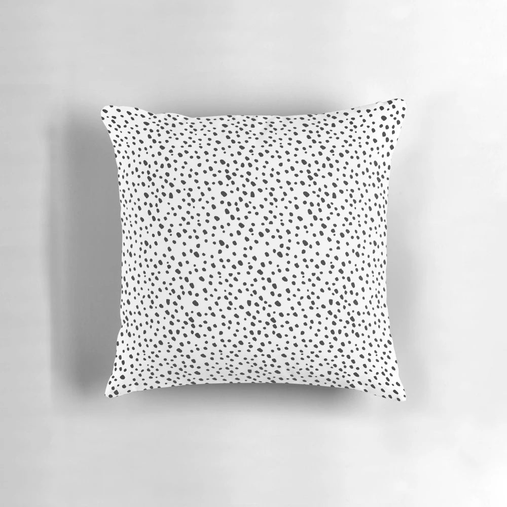 Decorative black and white polka dot pillow