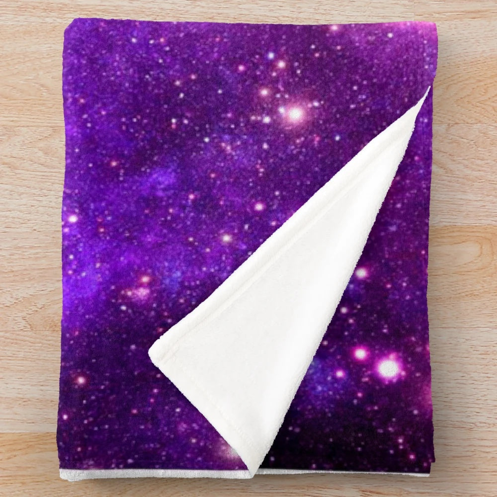 Soft and cozy pink and purple galaxy nebula plush blanket