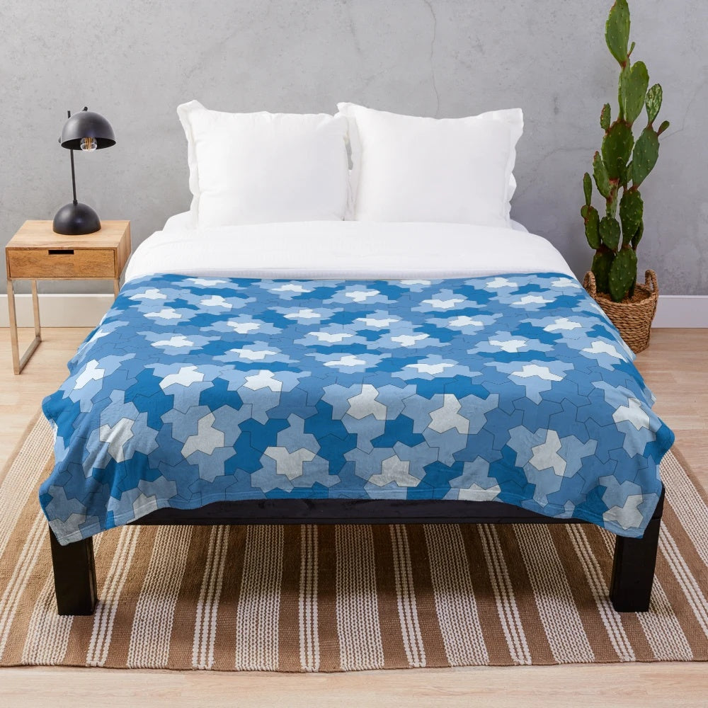 Geometric plush blanket with aperiodic Einstein tile patterns in shades of blue