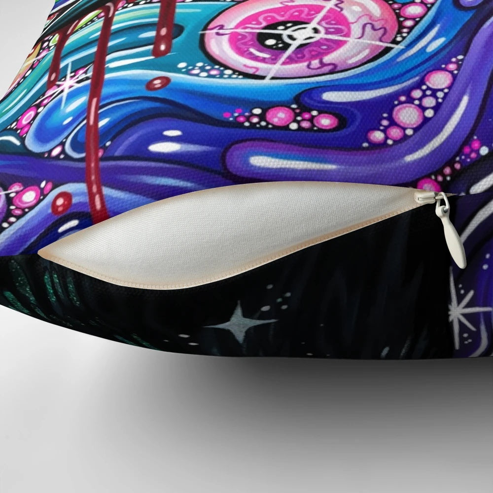 A decorative throw pillow featuring a vibrant, psychedelic image of a crow with glittering feathers and intense eyes.