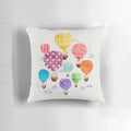 Vibrant hand-painted hot air balloon design on a plush, decorative pillow.