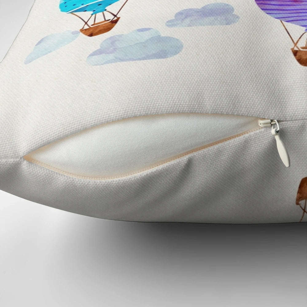 Vibrant hand-painted hot air balloon design on a plush, decorative pillow.