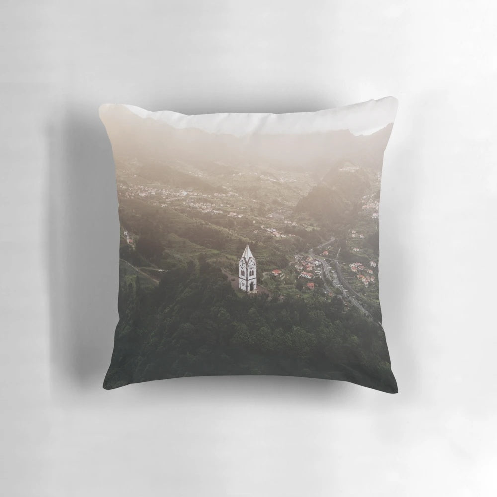 Pillow featuring a captivating drone view of a serene Madeira sunset with deep green, cinematic tones.