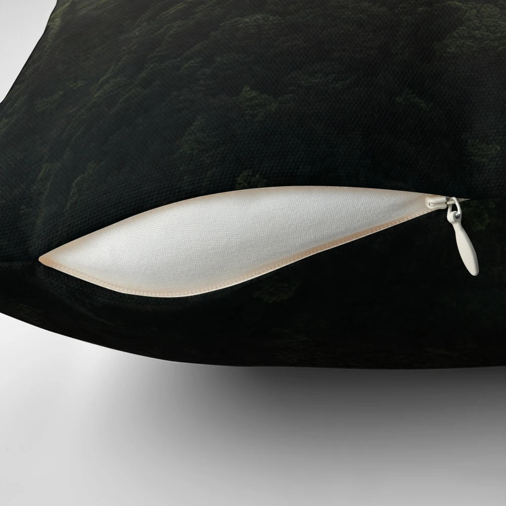 Pillow featuring a captivating drone view of a serene Madeira sunset with deep green, cinematic tones.