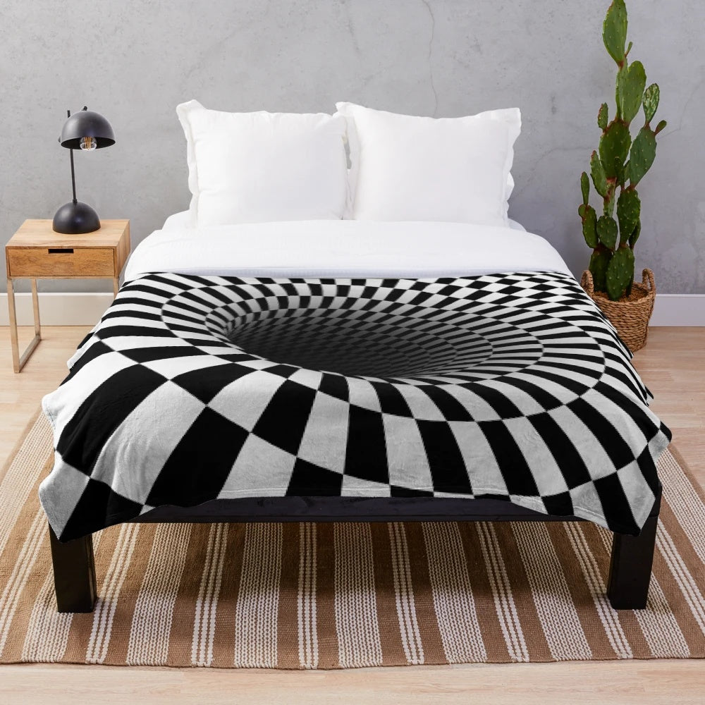 Black and white optical illusion plush blanket with a hypnotic checkered pattern